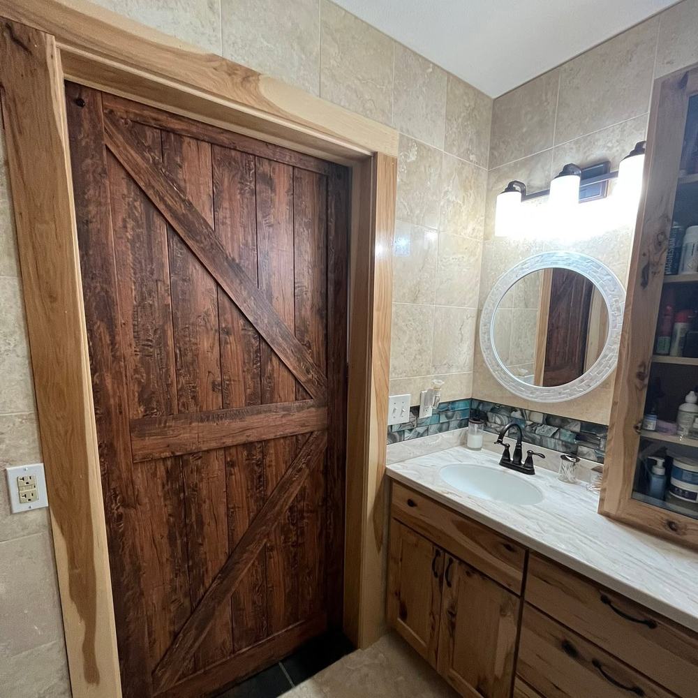Sliding barn door on a bathroom, timber frame and cased opening